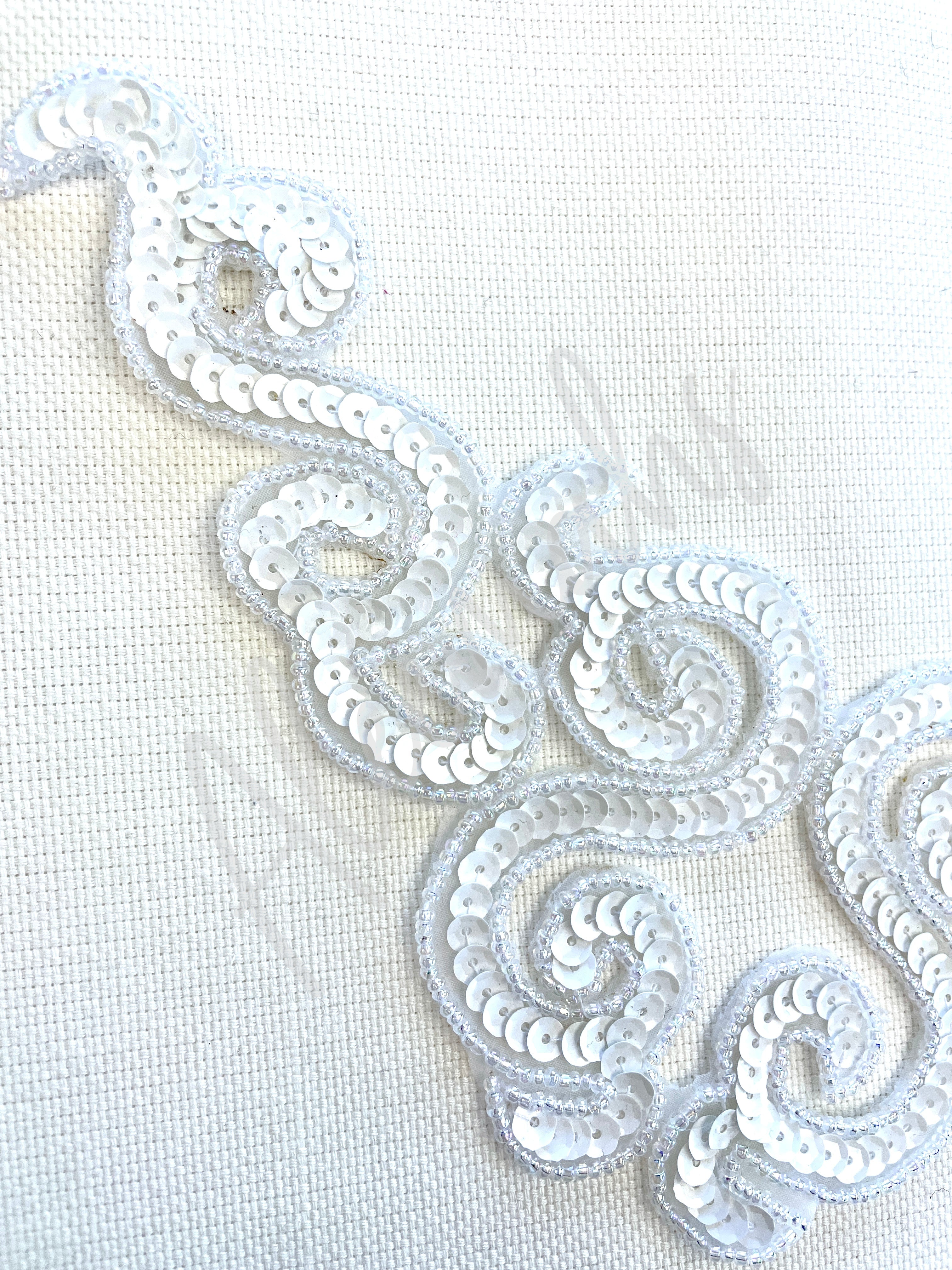 A-107: White sequin and bead applique