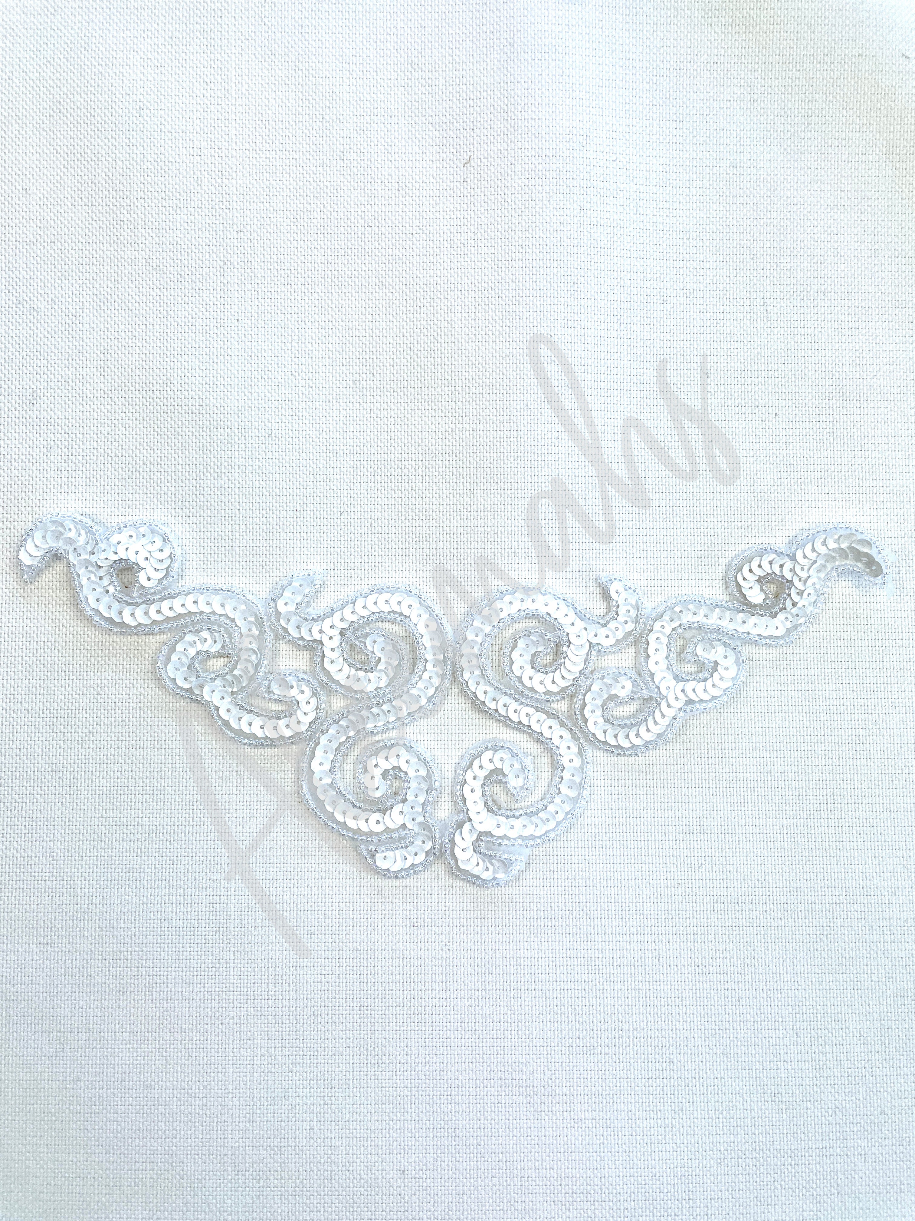 A-107: White sequin and bead applique